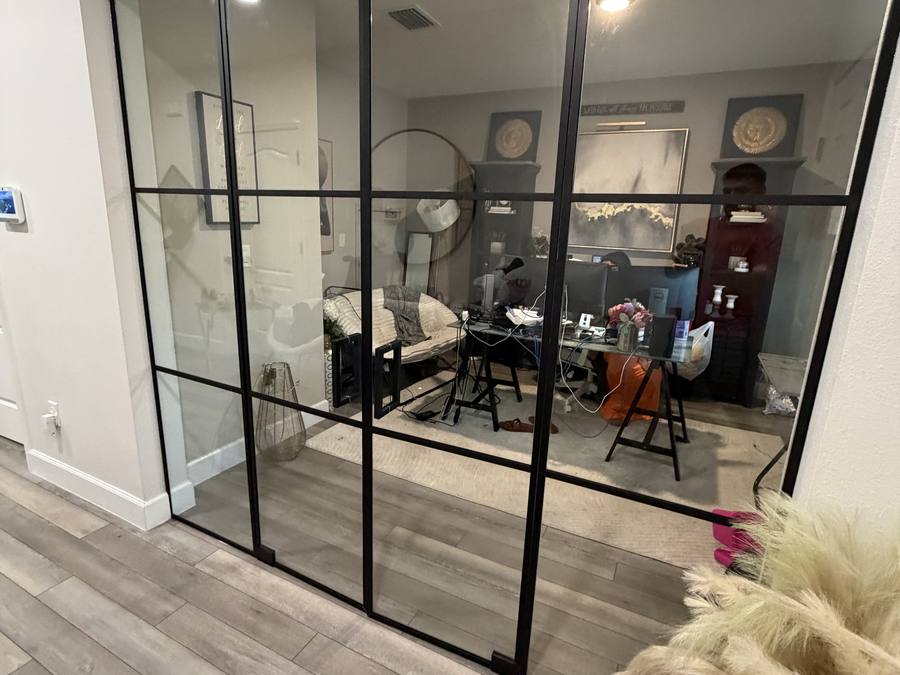 Frameless glass enclosure for a residential home office